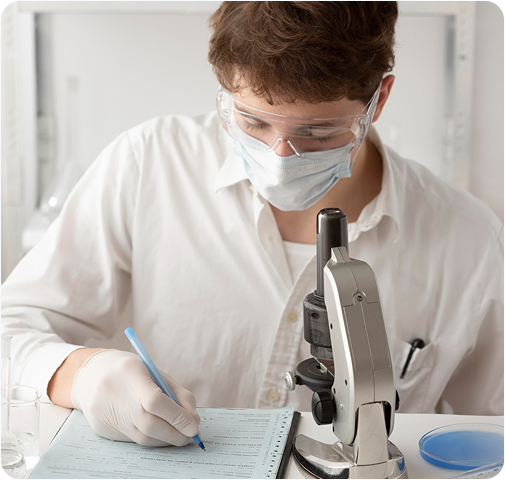 Scientist at microscope