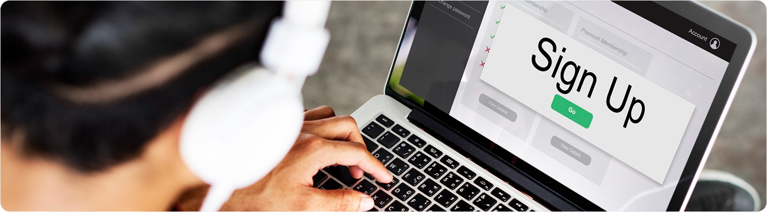 Person signing up on laptop